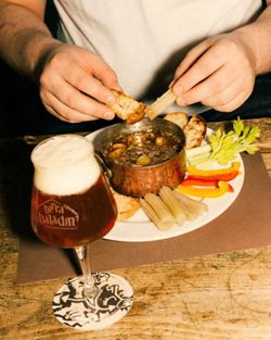 Delicious small dish with dipping vegetables and bread, paired with a Baladin craft beer.
